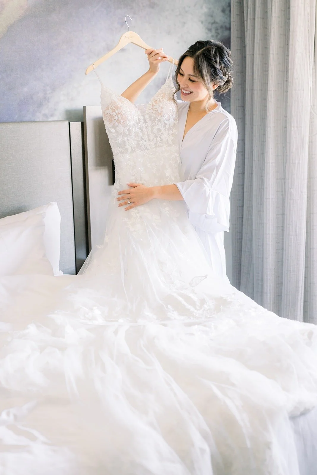 Josephine admiring her gown laid across the bed