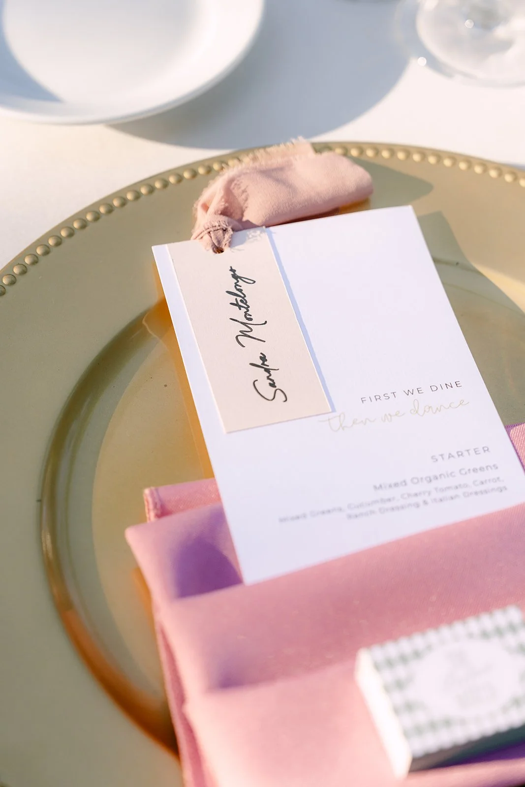 Place card and menu on a gold charger.