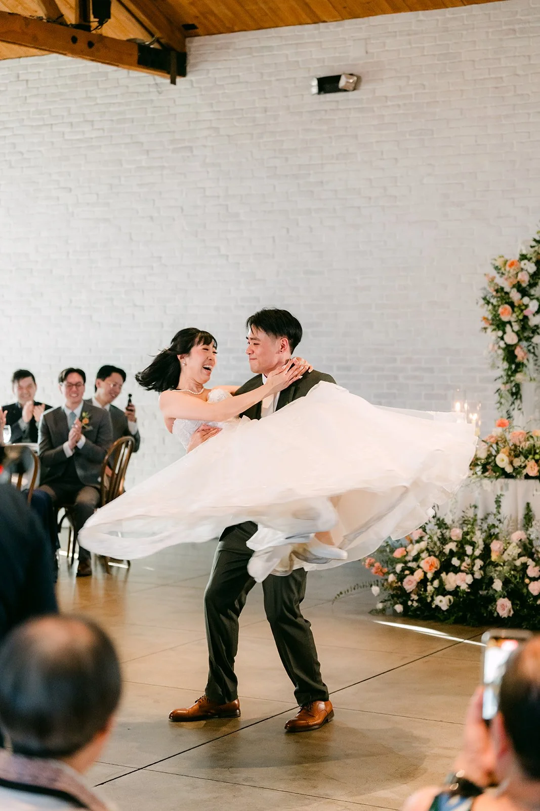 Alex spinning Vivian in a lift during their first dance at The Colony House