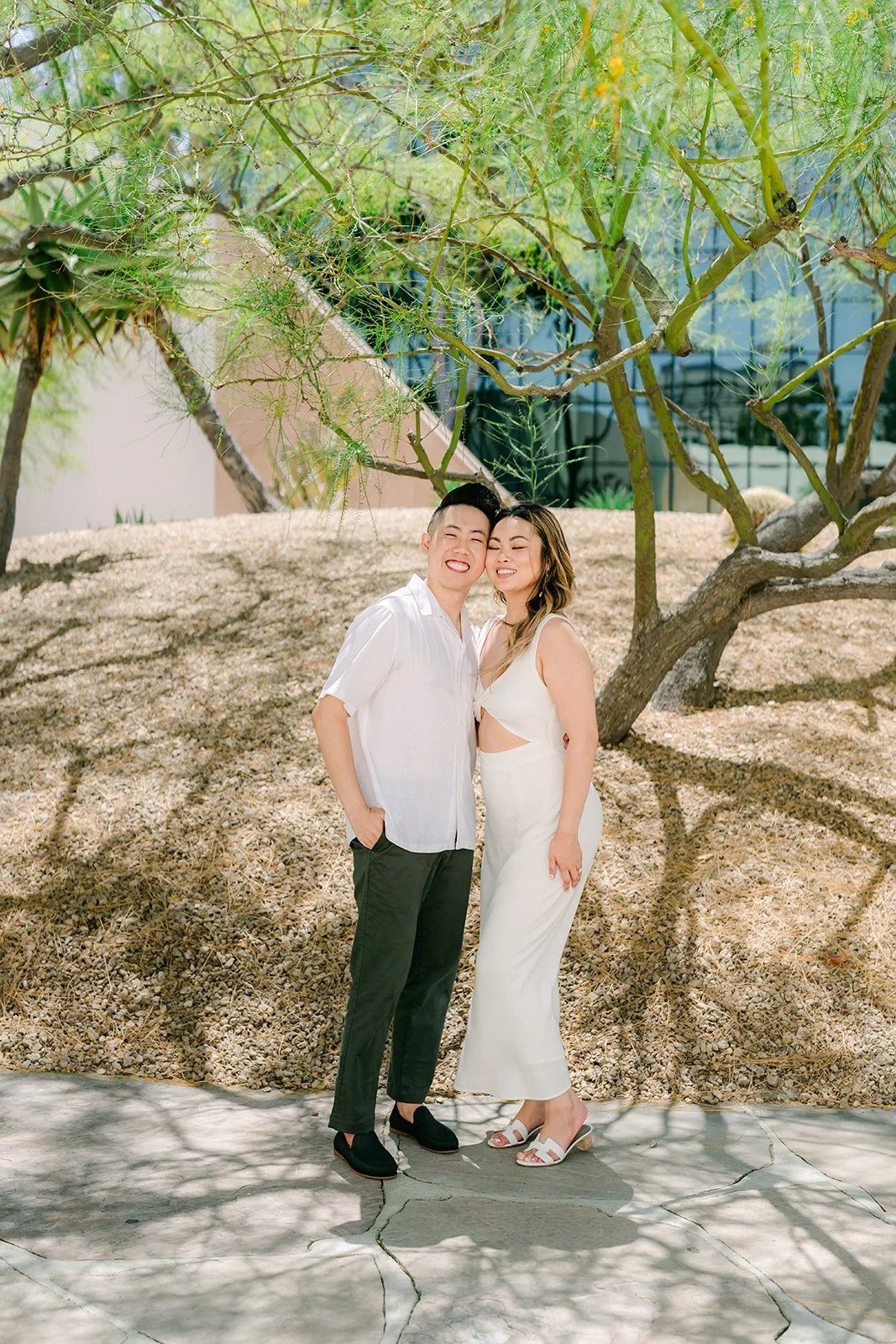 Stephanie and Alan in the desert garden beneath a palo verde tree.