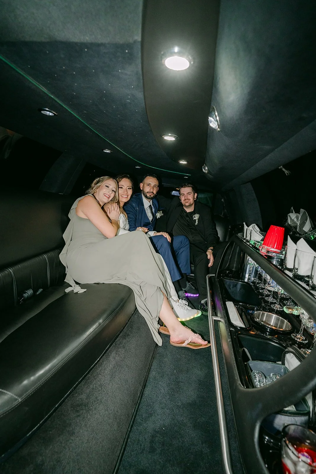 Friends riding along inside the limo at the end of the night, photographed by One and Only Production