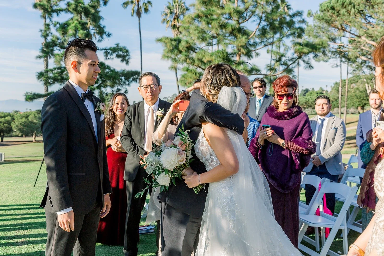 Guests watching as Josephine arrives at the ceremony