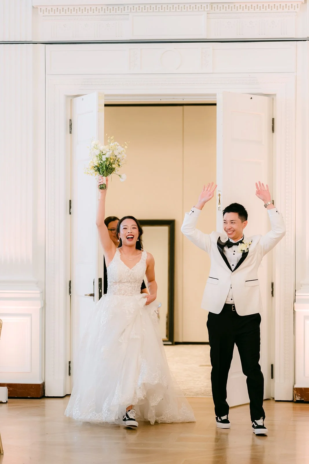 Jenny and Ryan making their grand entrance through the ballroom doors.