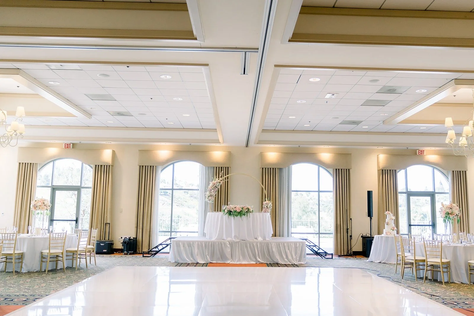 Wide view of the ballroom with its dance floor and round tables
