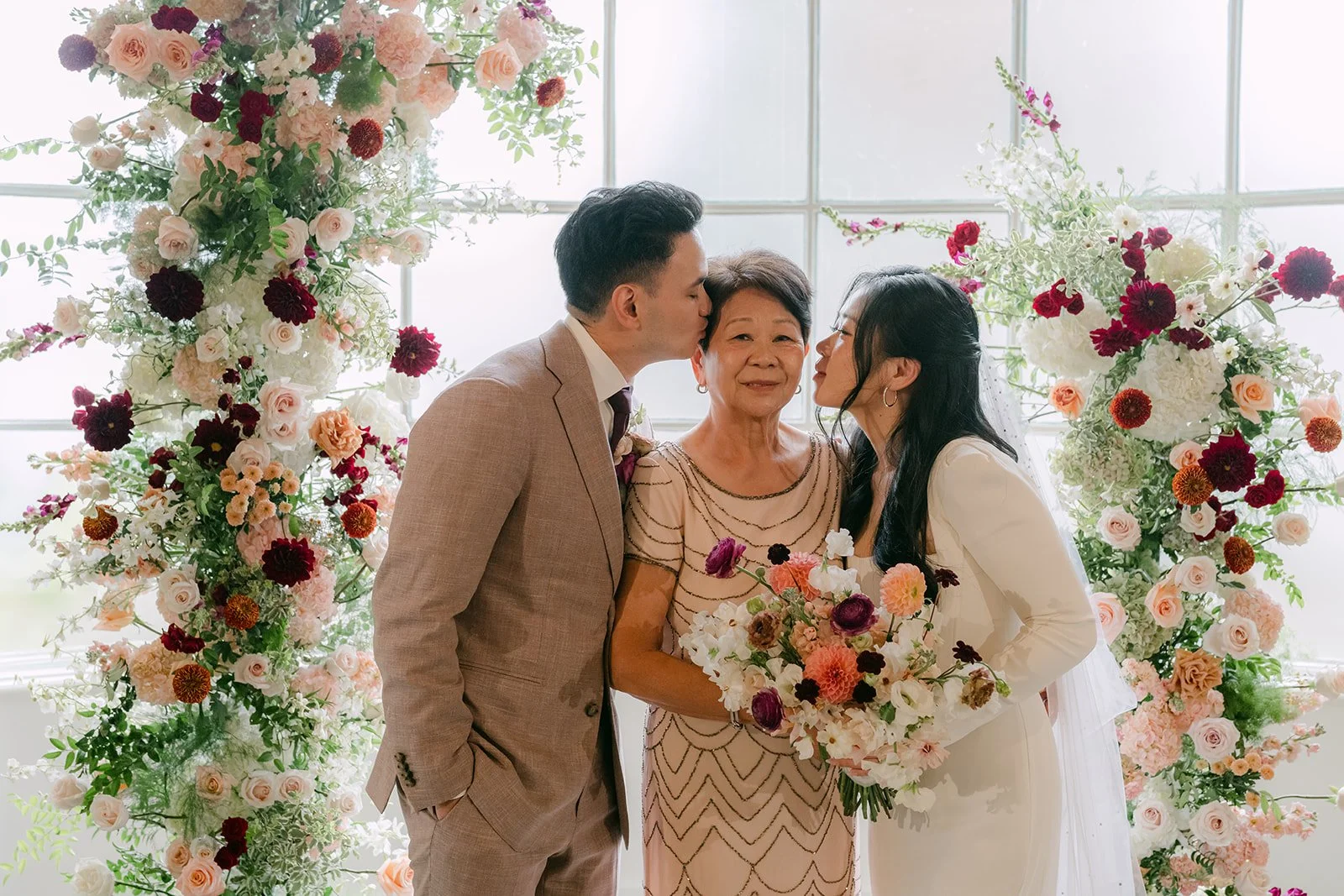 Michael giving Denise's mom a kiss on the cheek.