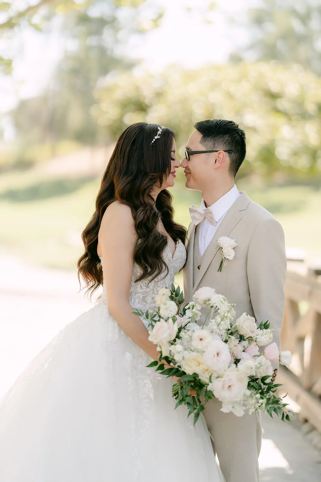 Kevin kissing Sandra as she holds her bouquet.
