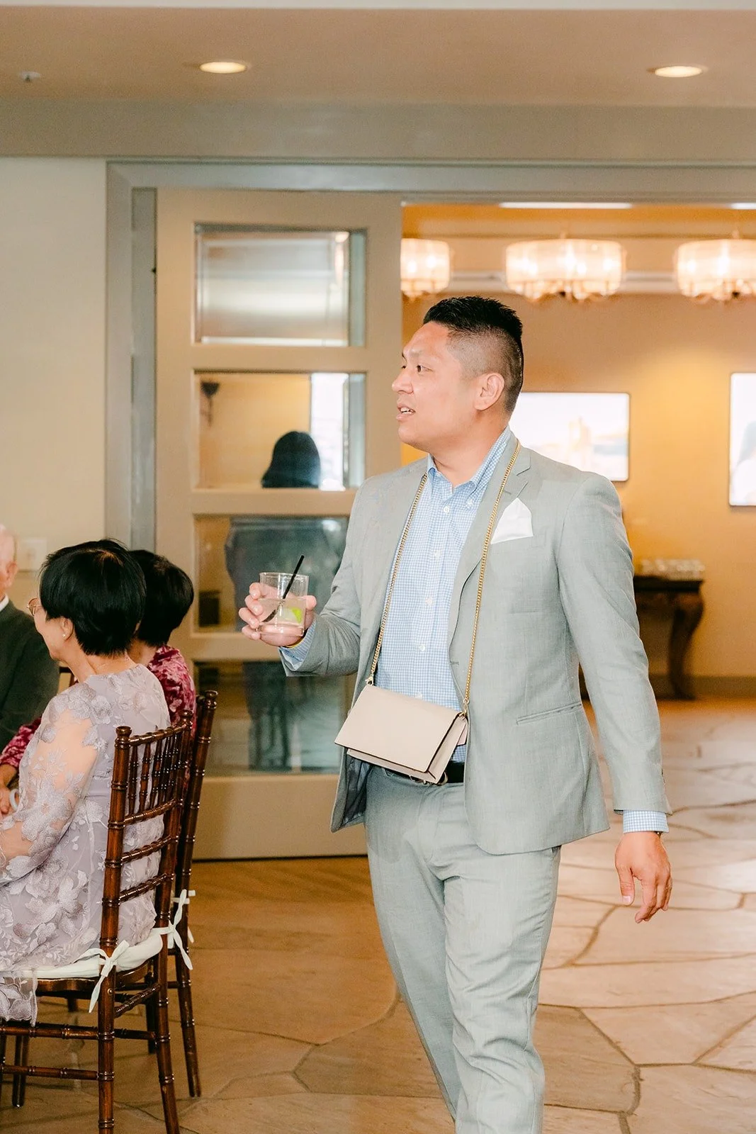 A groomsman making his entrance into the ballroom