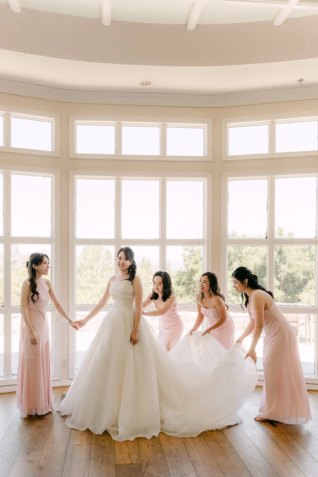 Judy's bridesmaids holding hands around her