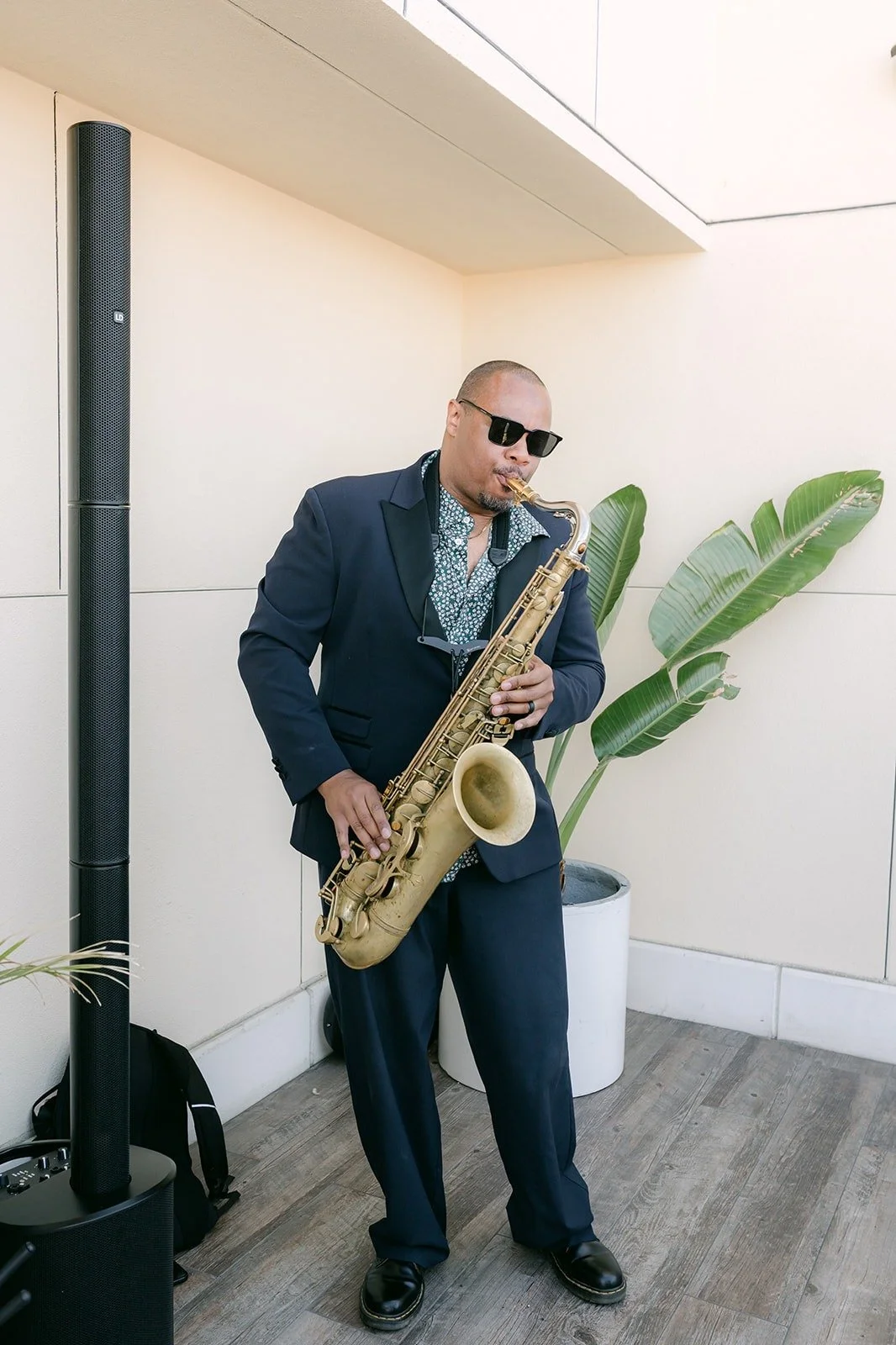 A saxophone player performs during cocktail hour