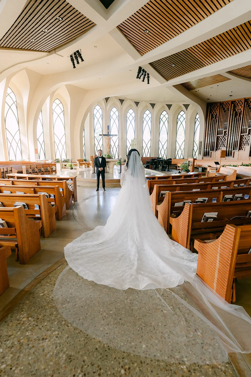 Kim's cathedral train down the aisle of St. John Fisher Church