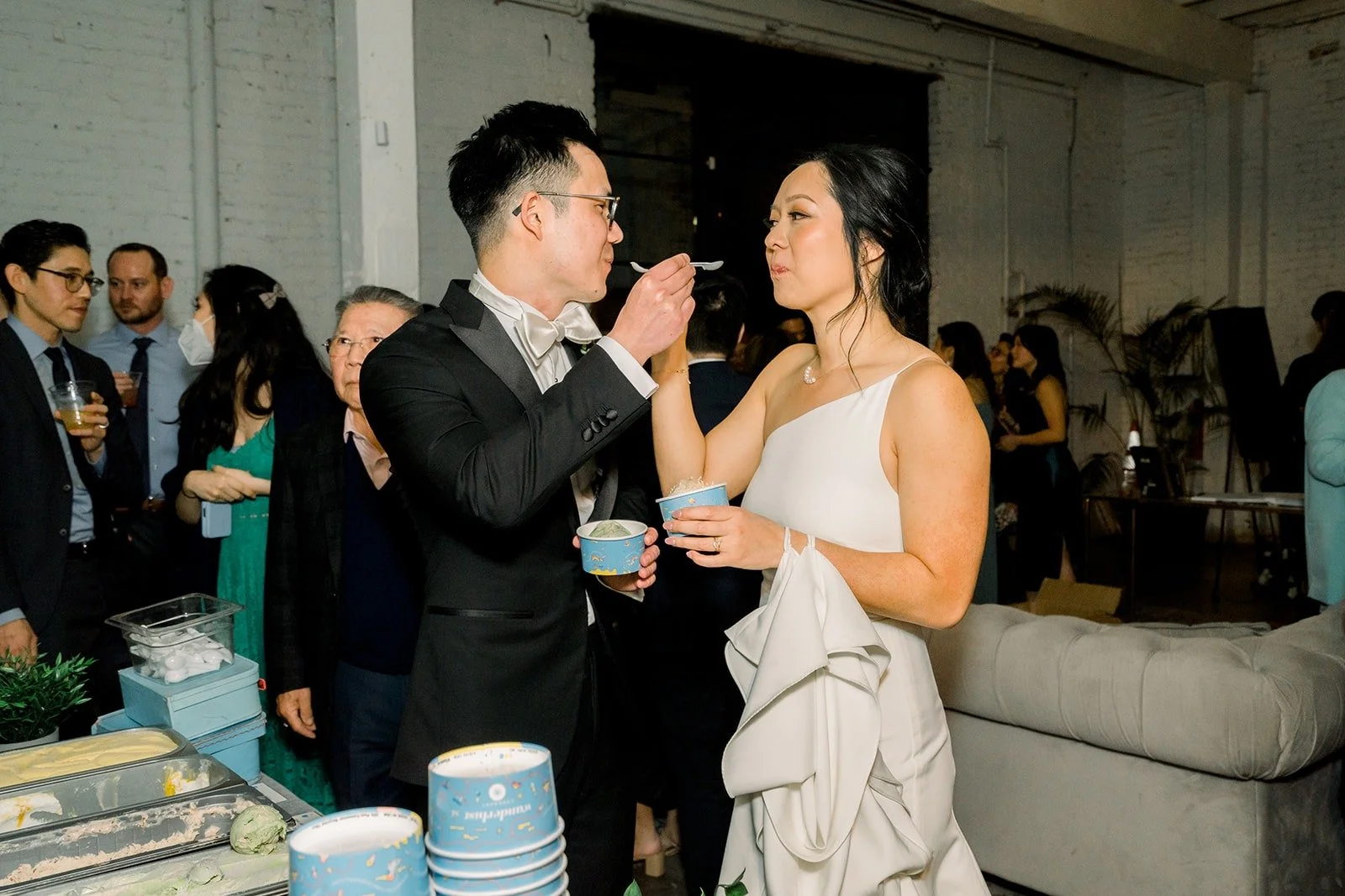 Cindy and Alex share a bite of ice cream