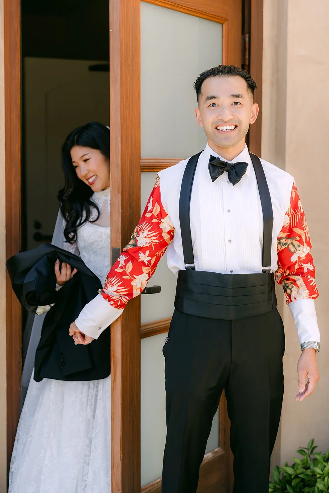 Vincent showing the custom lining of his tuxedo jacket at the door