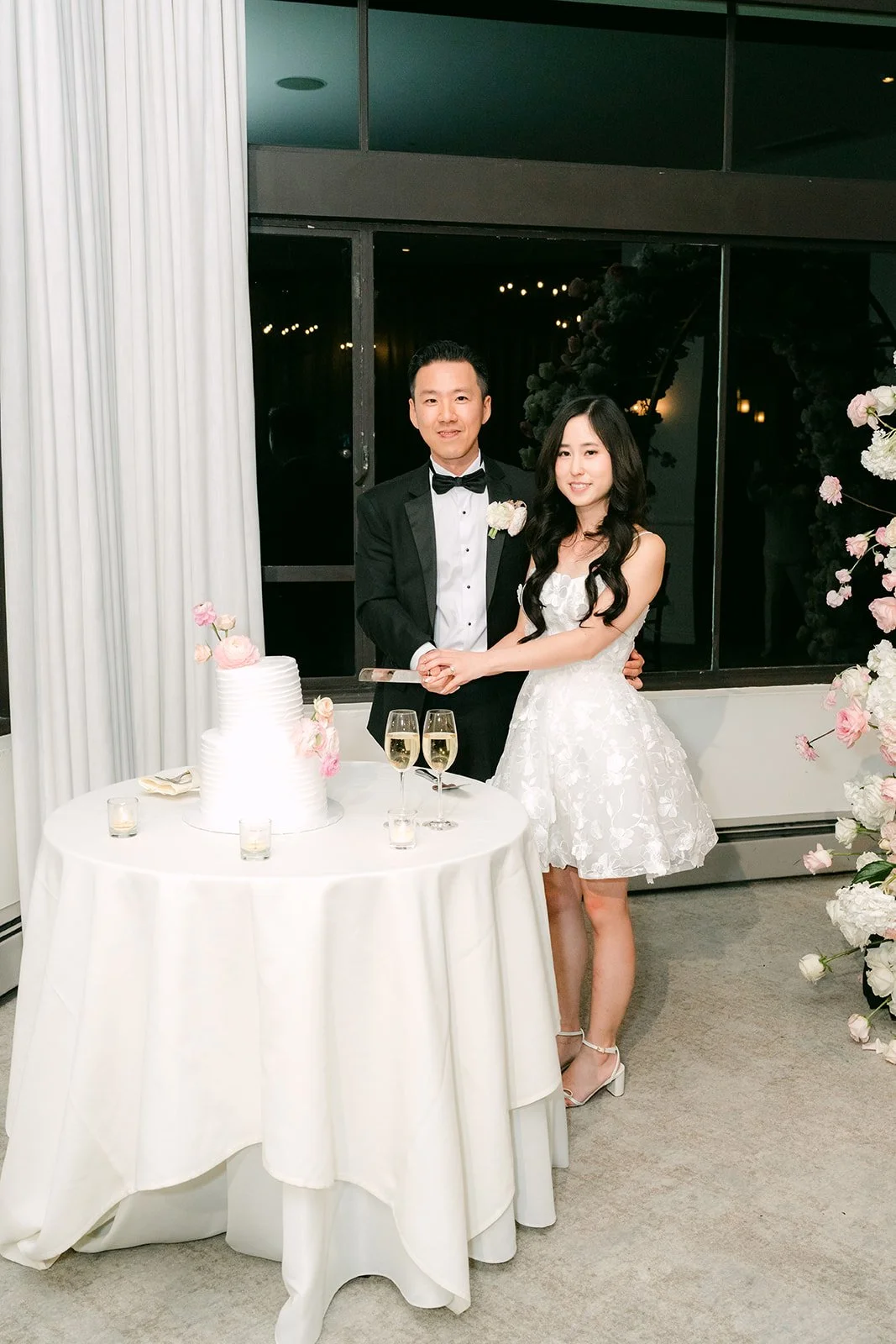 Kelley and Kai cutting their wedding cake