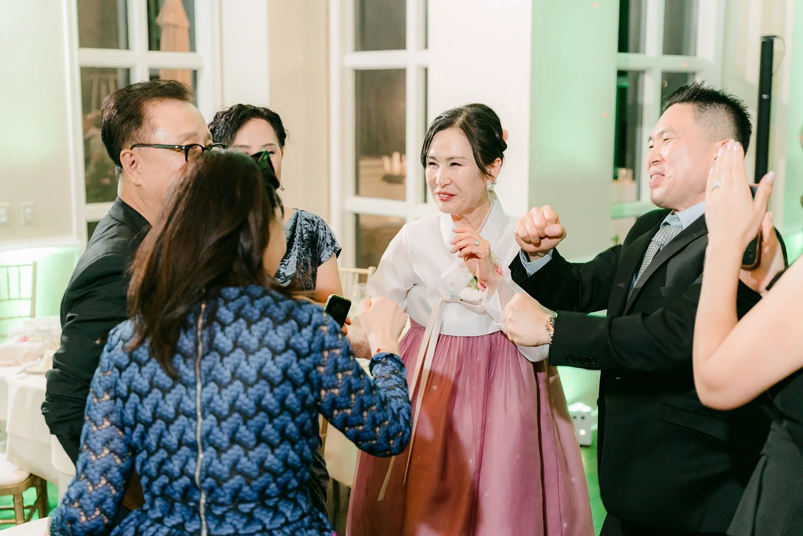 Family and friends dancing at the end of the night, photographed by One and Only Production