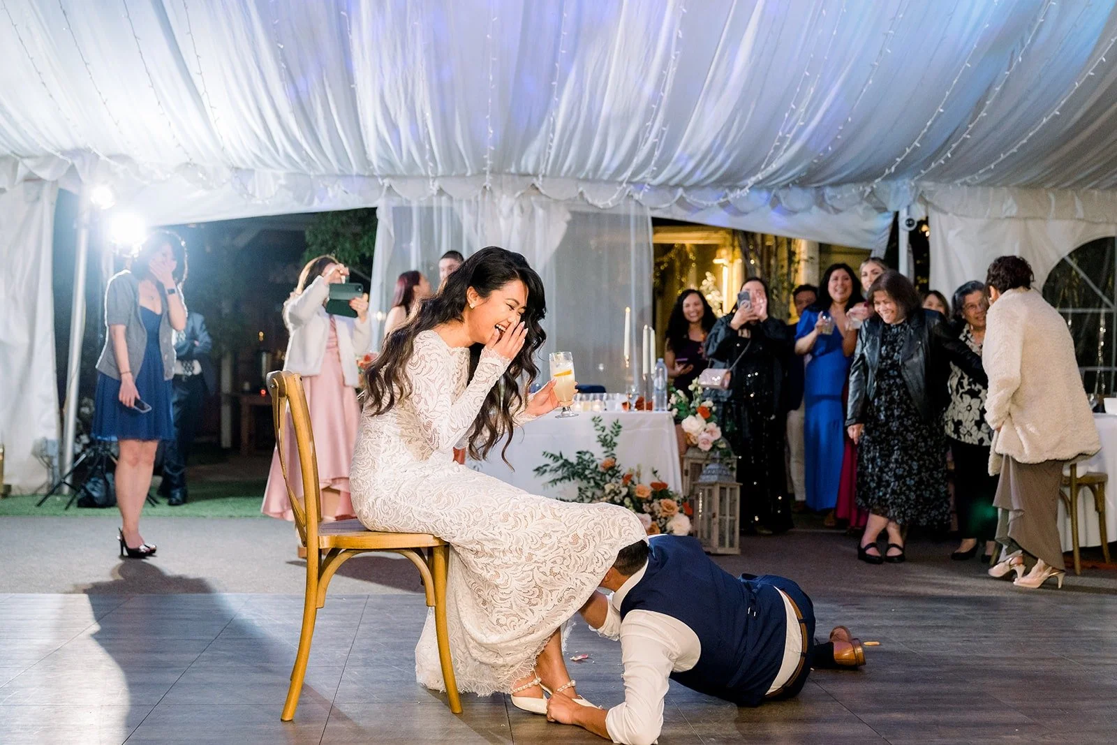 Vincent removing the garter on the dance floor