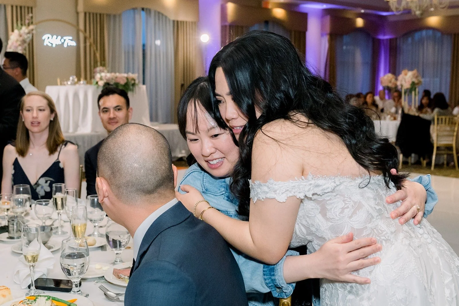 Francesca hugging a guest at the reception