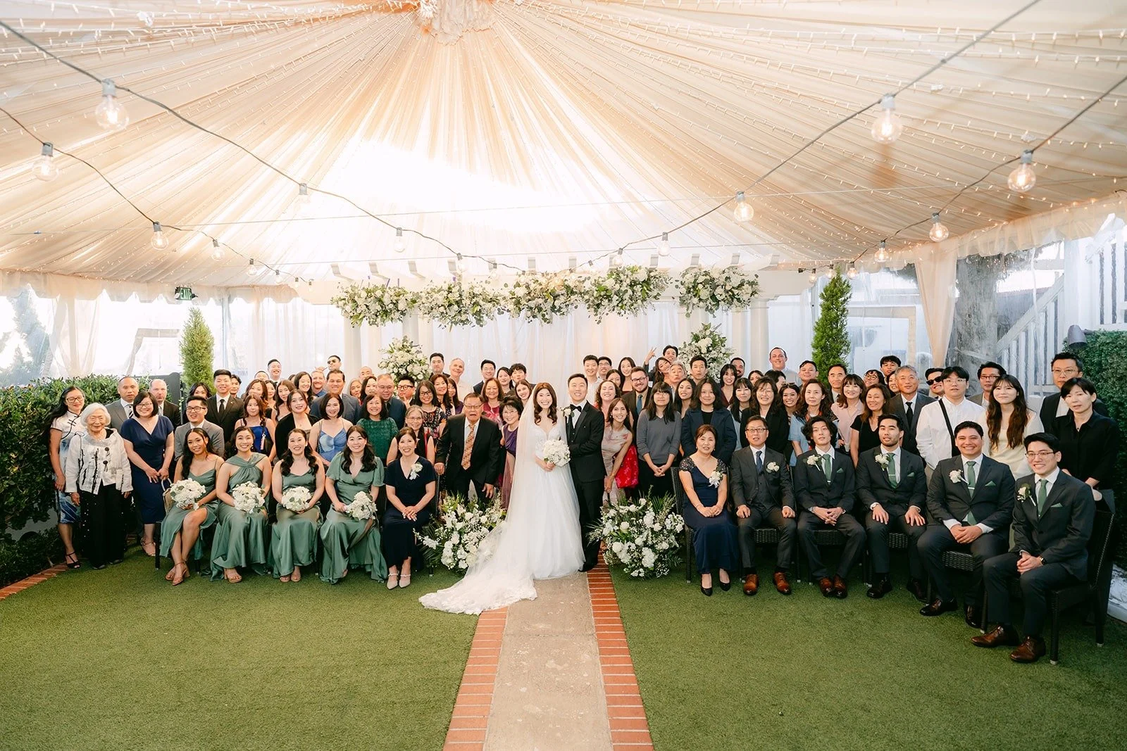 All of Valerie and Jason's guests gathered under the ceremony canopy for a group photo
