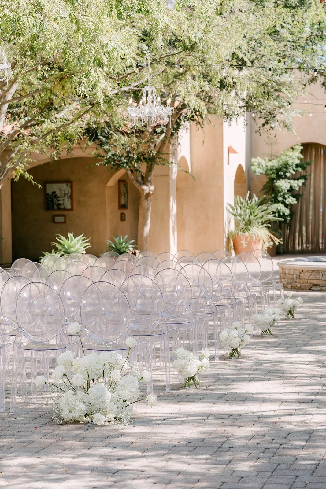 Ceremony aisle lined with white hydrangea and baby's breath