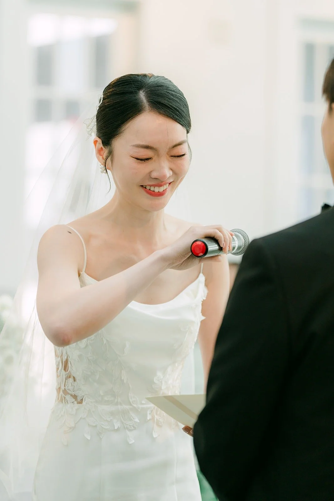 Tin laughing during the ceremony
