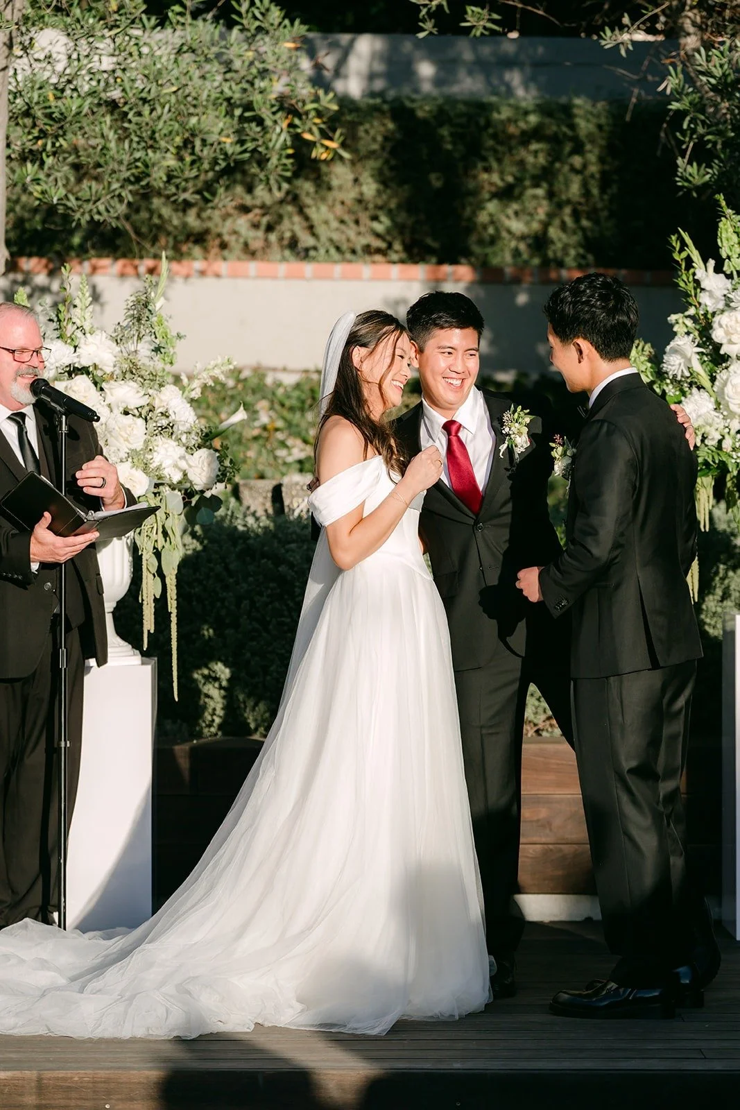 Jadee and Richard exchanging vows with officiant Stanley Doll
