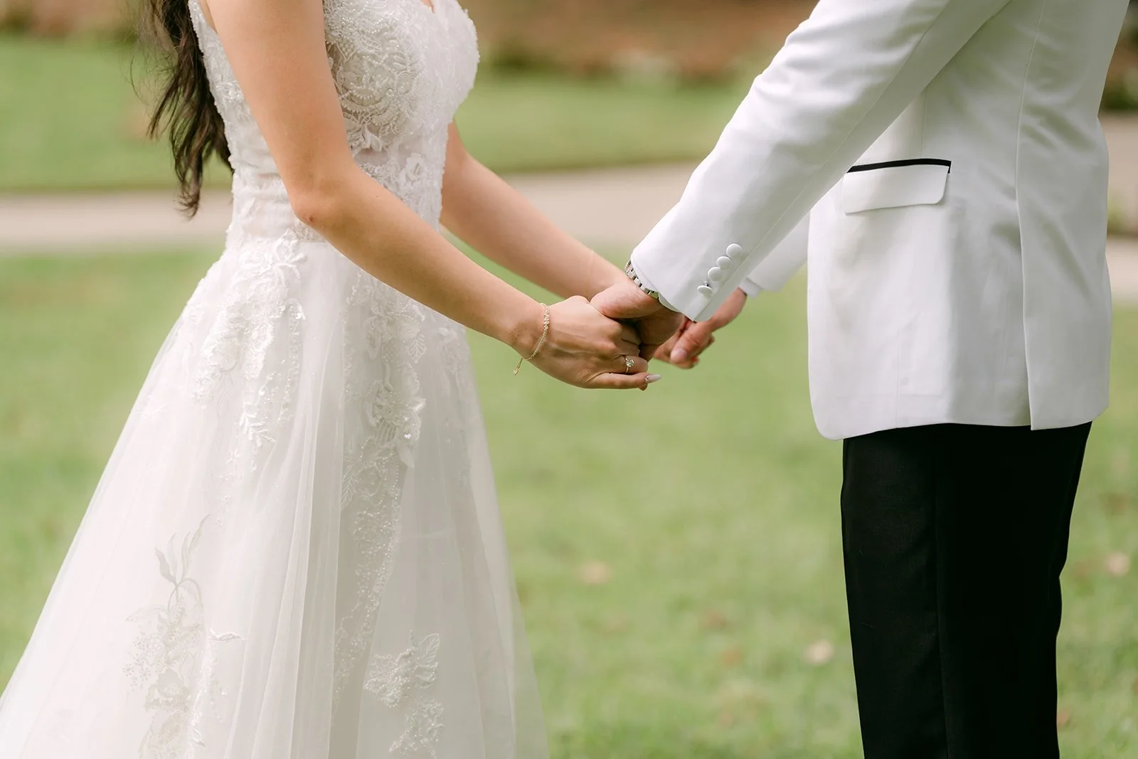 Jenny and Ryan holding hands during their first look.