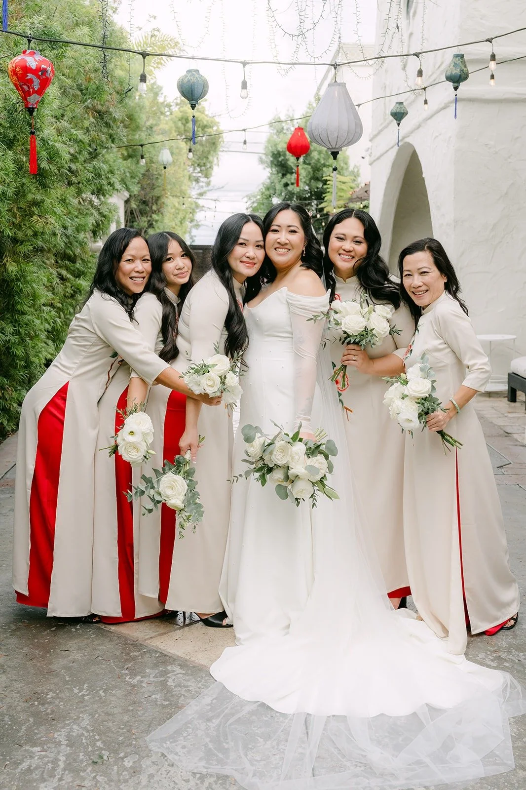 Vivian with her bridesmaids in ivory and red
