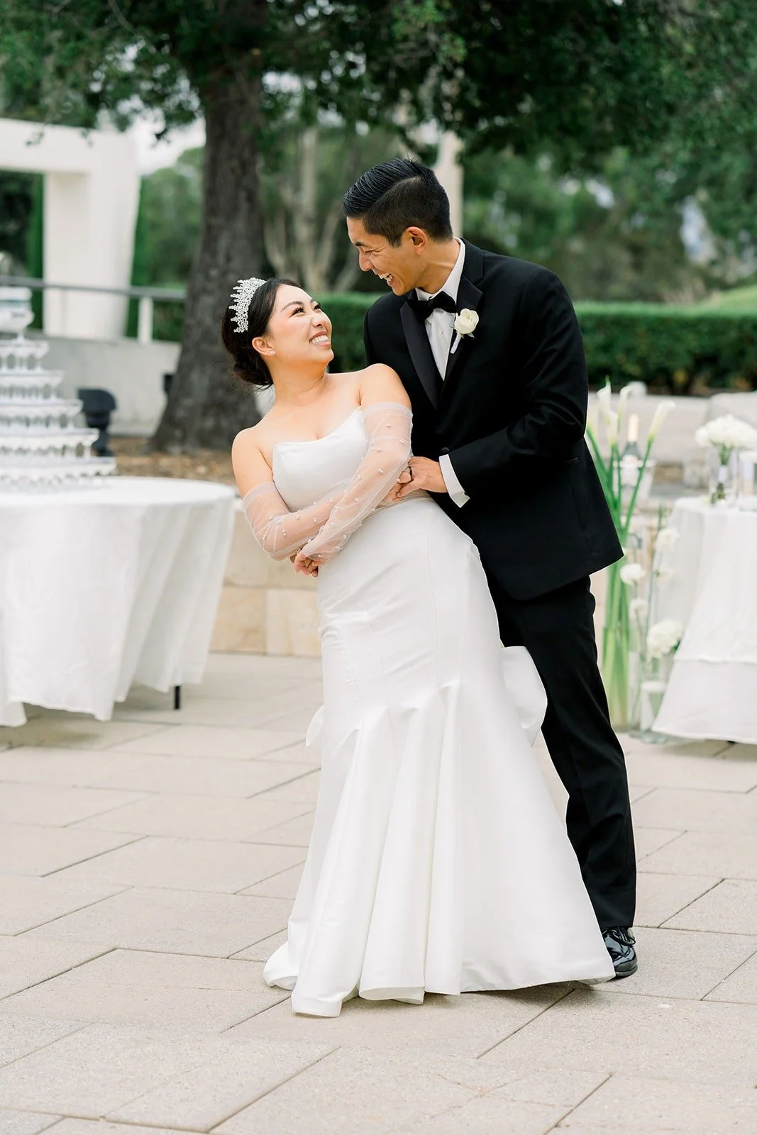 Jacinda smiles up at Steven as they dance