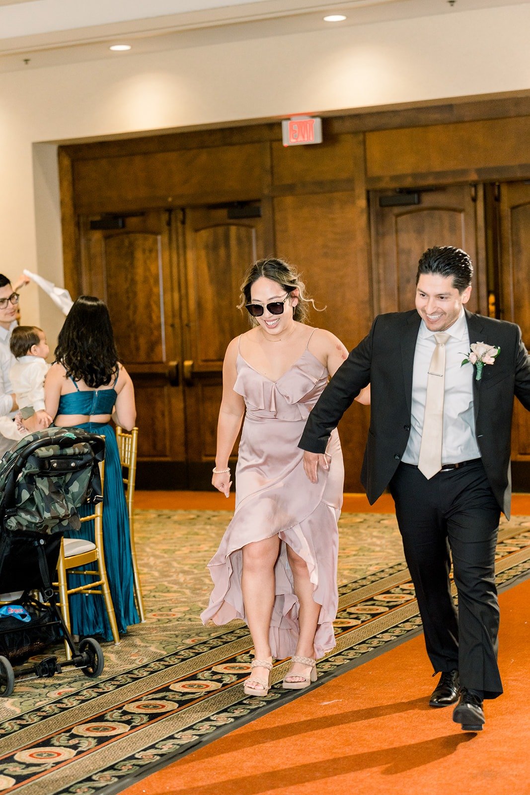 Members of the wedding party dancing into the reception