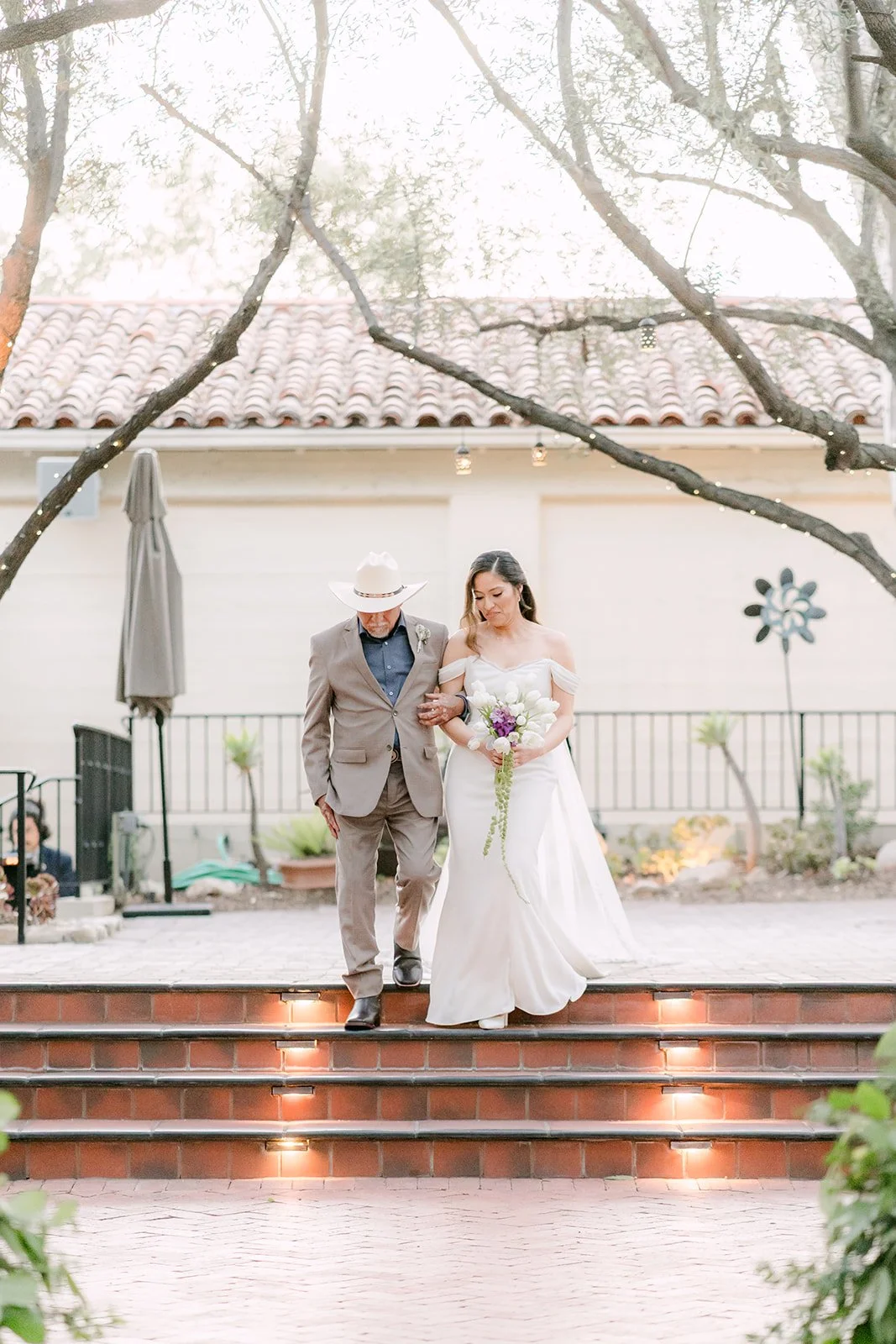 Mariana and her dad at the top of the courtyard steps before the processional