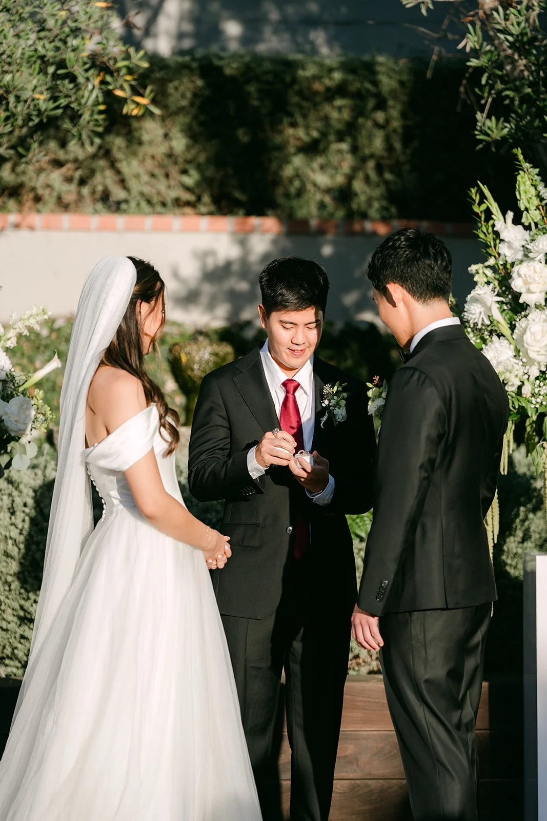 Officiant leading the vows as Jadee and Richard face each other