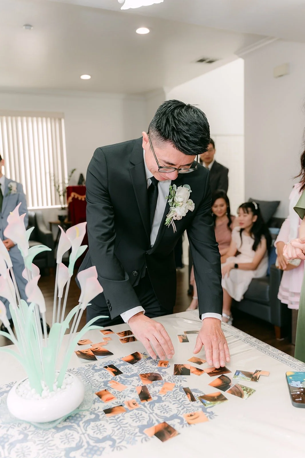 Eric working through a photo puzzle on the table during the door game