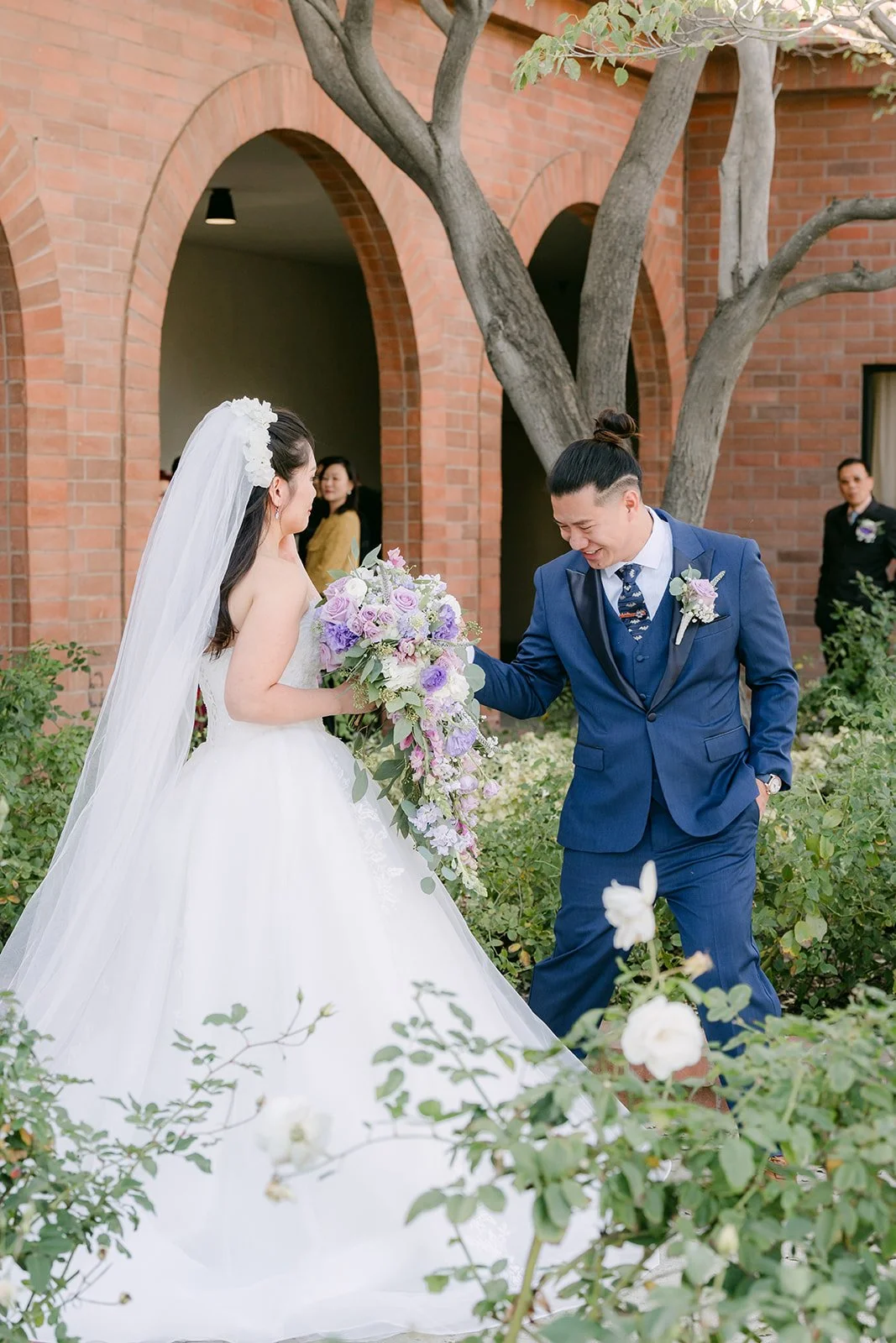 Kate and Michael sharing a kiss after their first look.