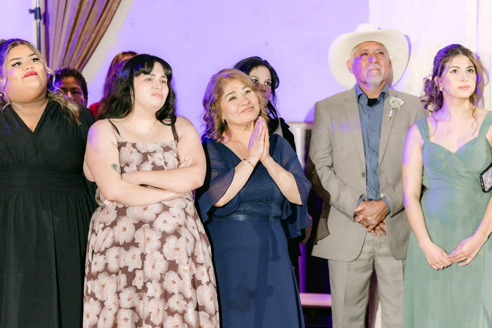Family members watching the parent dances