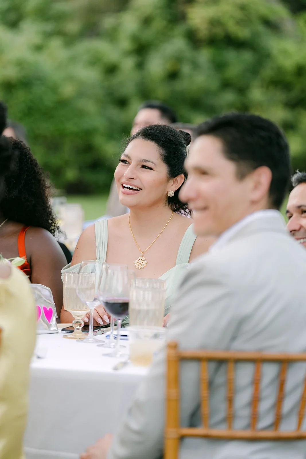 Friends and family smiling through the speeches