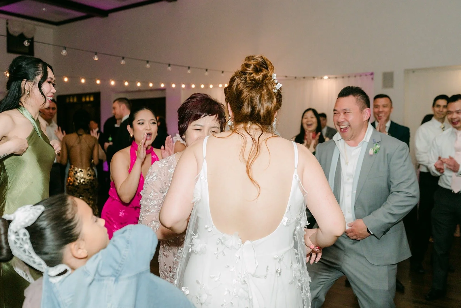 Joanna dancing in the middle of her friends