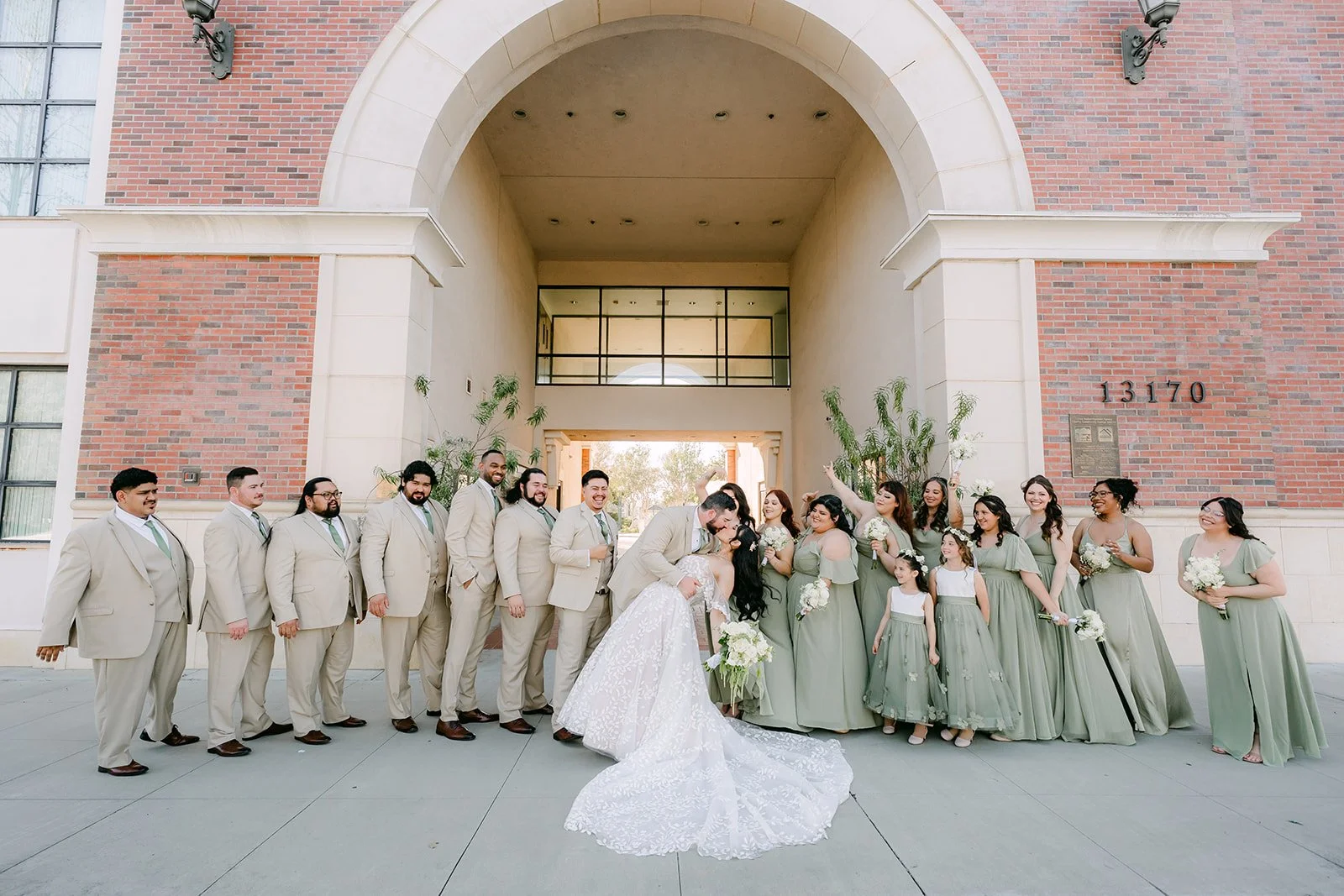 Fernanda and Cody with their wedding party in a long line.