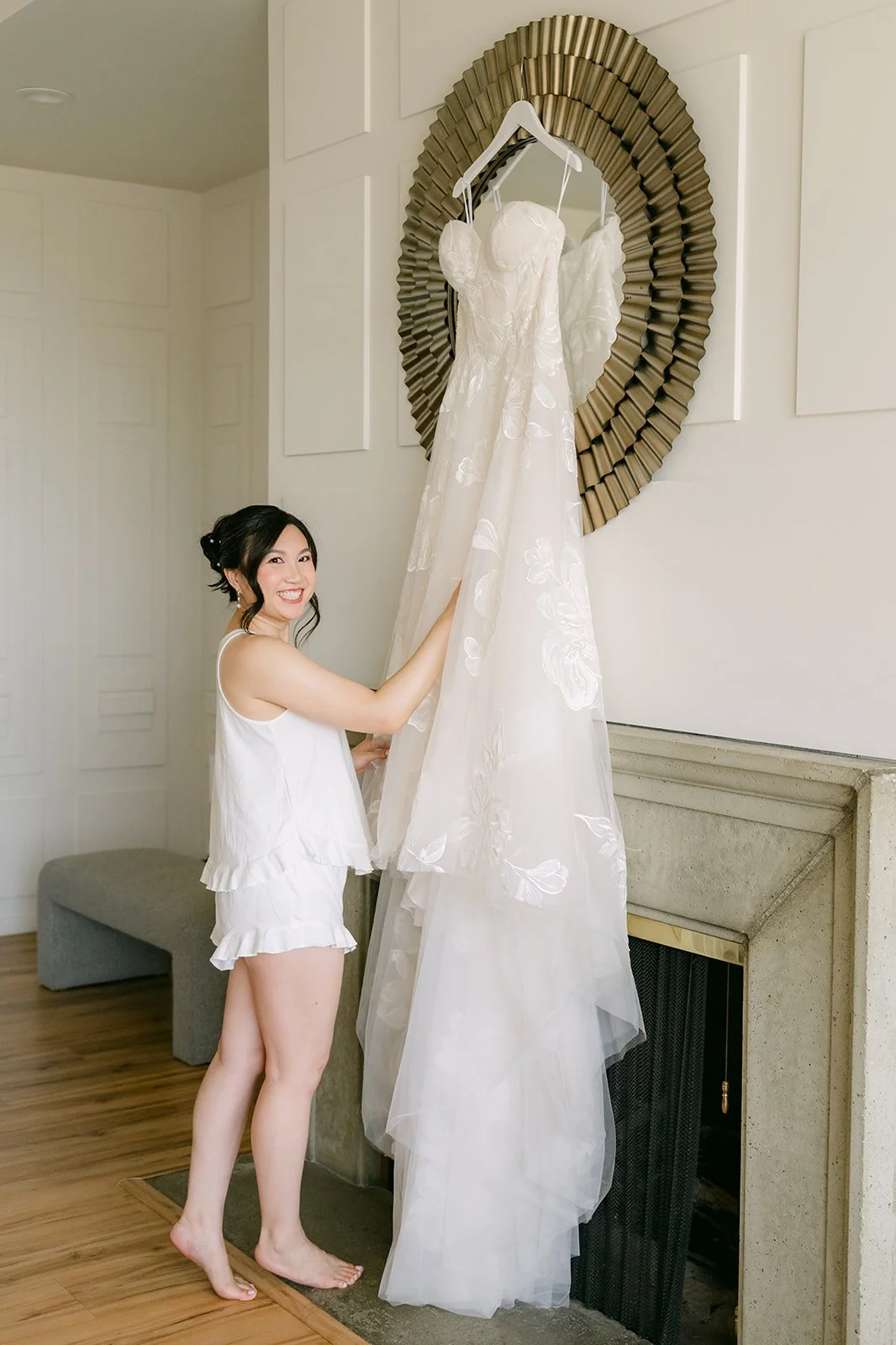 Mary admiring her gown before getting ready