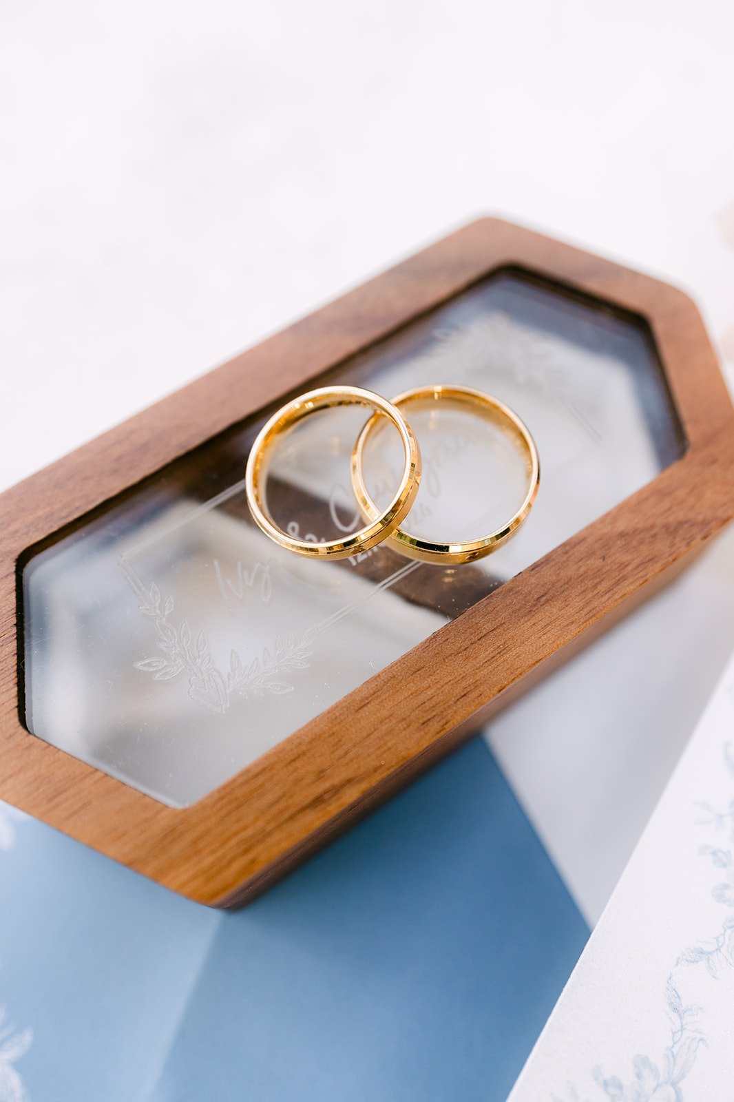 Wedding bands in a wooden hexagon ring box