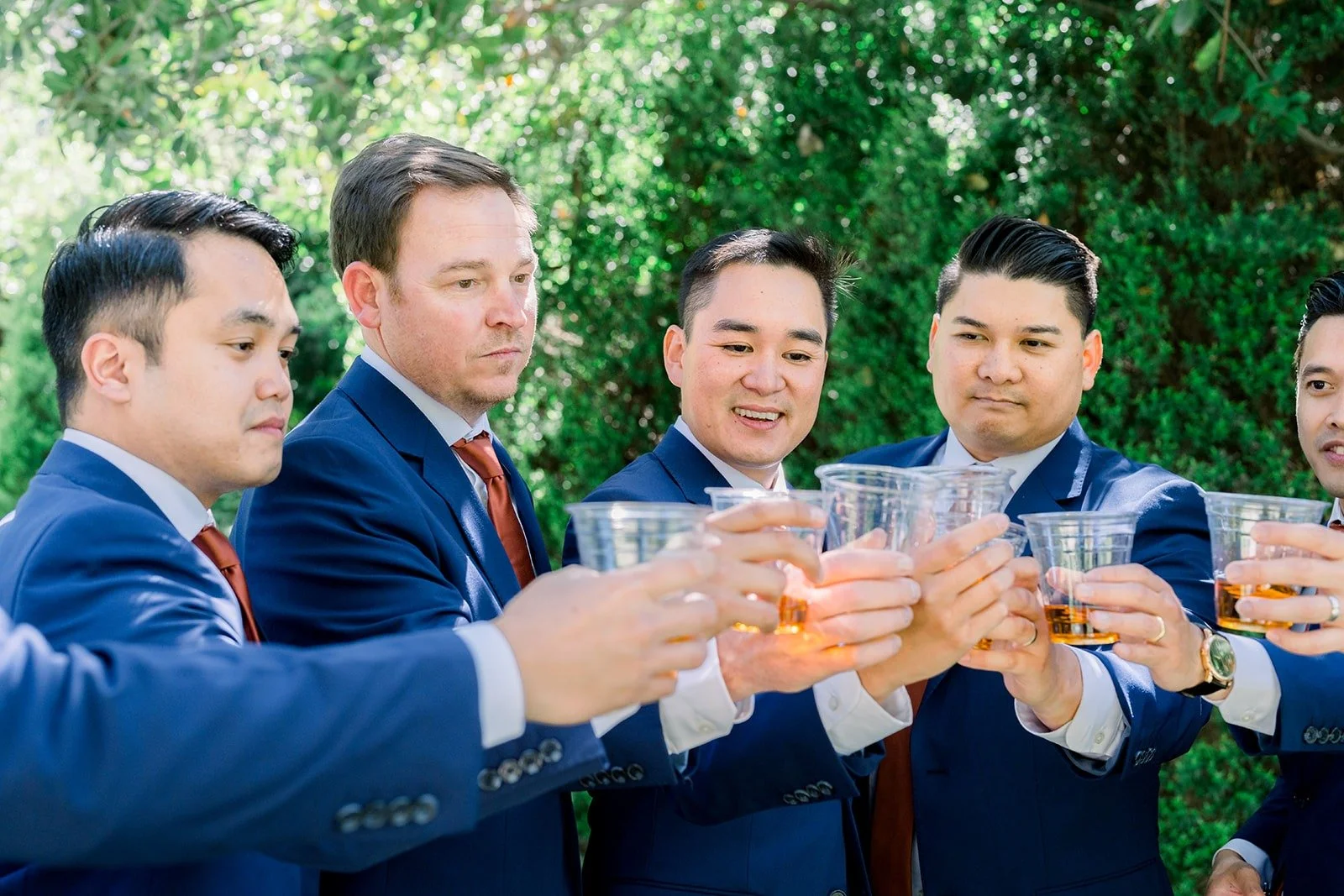 Vincent and his groomsmen raising a toast