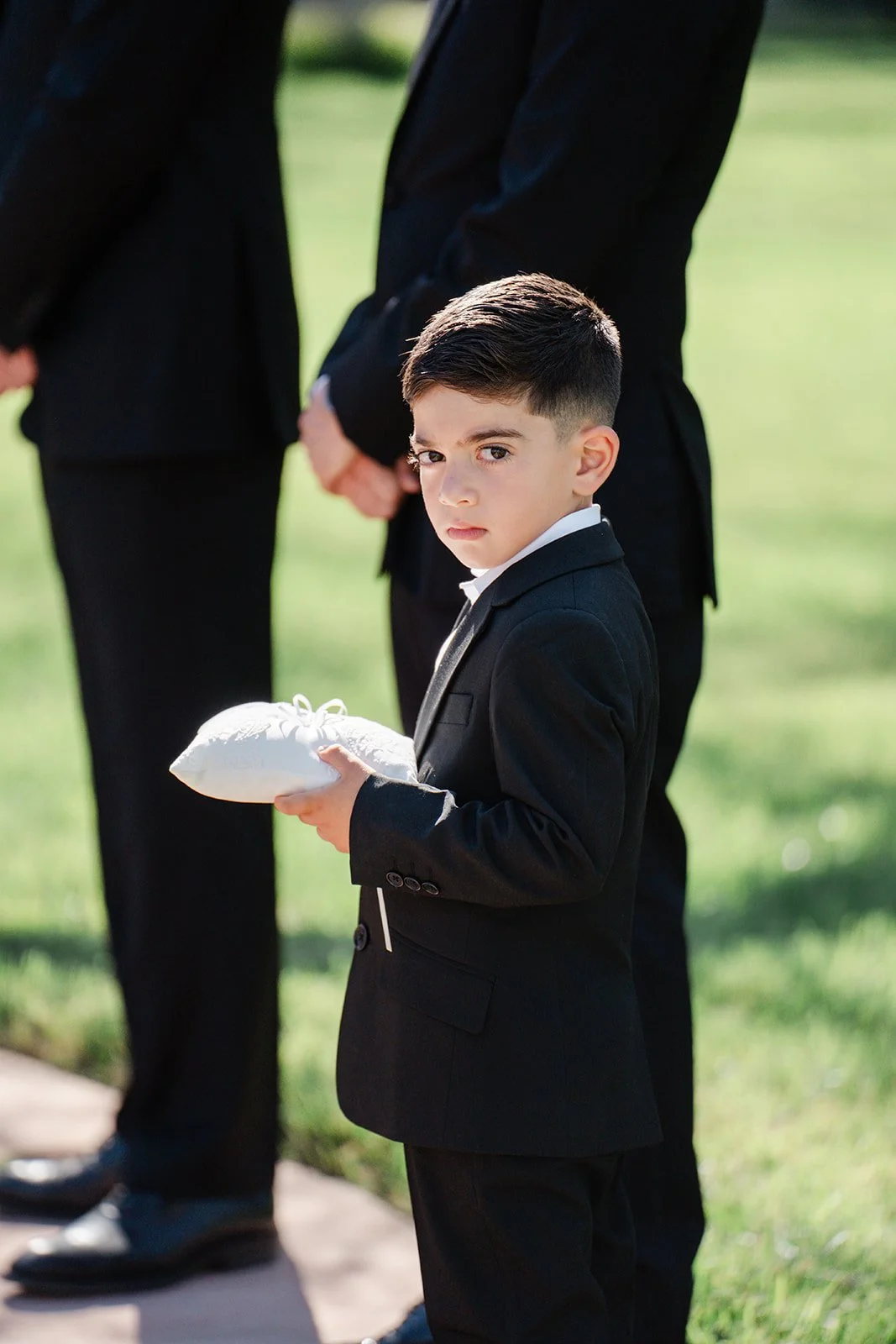 Ring bearer holding the ring pillow during the ceremony
