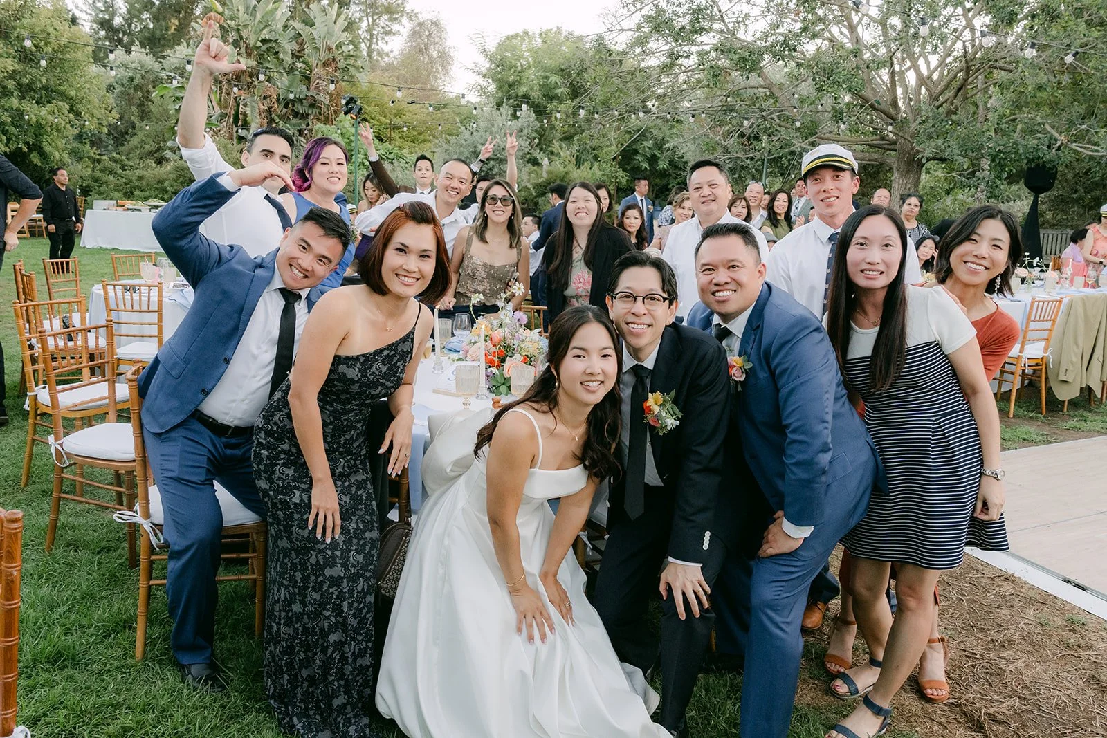 A big group photo with guests at the reception