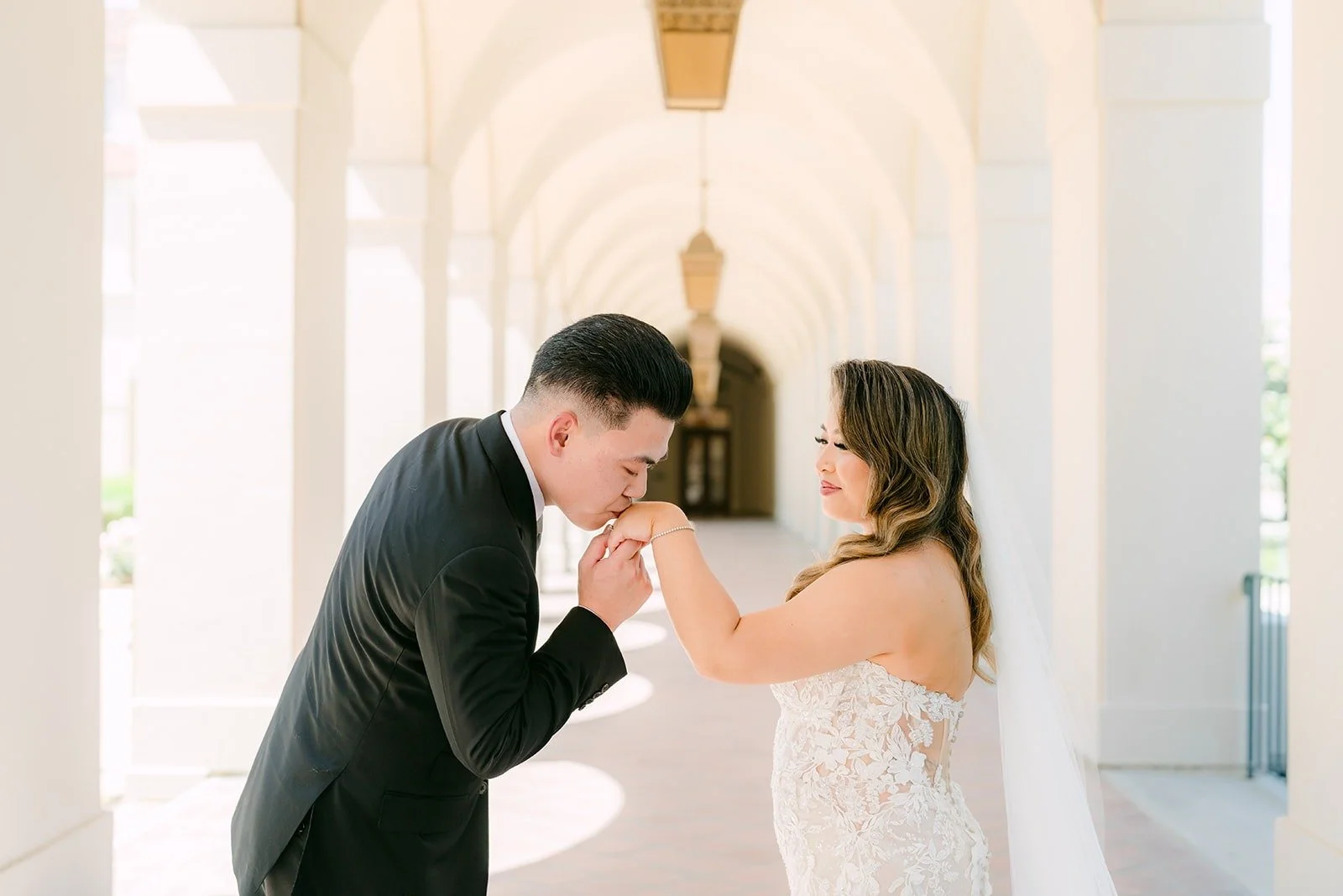 Vincent kissing Candice's hand under the arches
