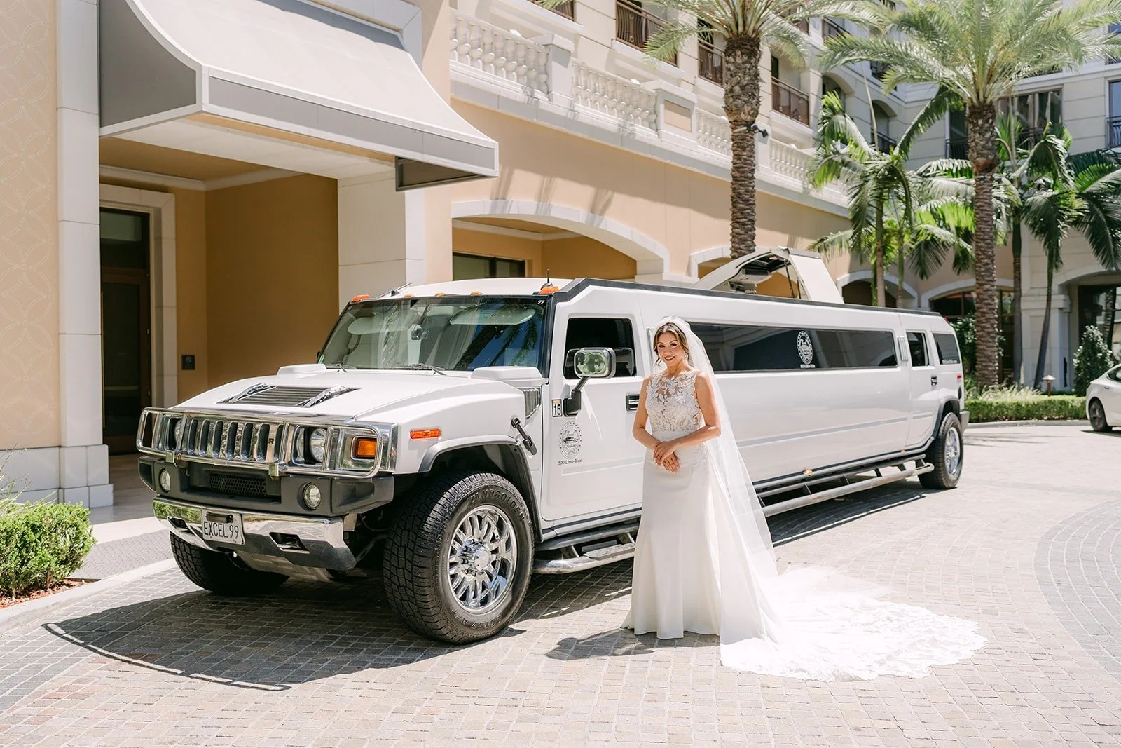 Francesca stands beside a white stretch limousine at The Westin Anaheim Resort