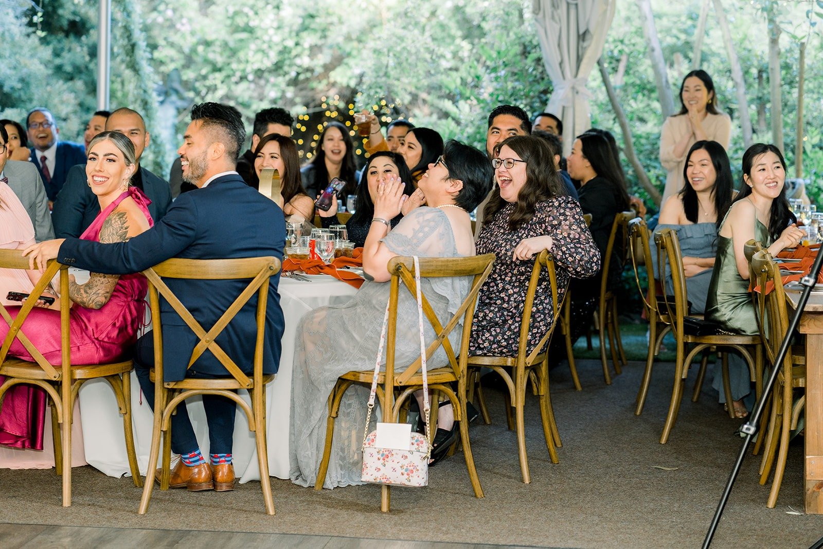 Guests at their tables under the reception tent