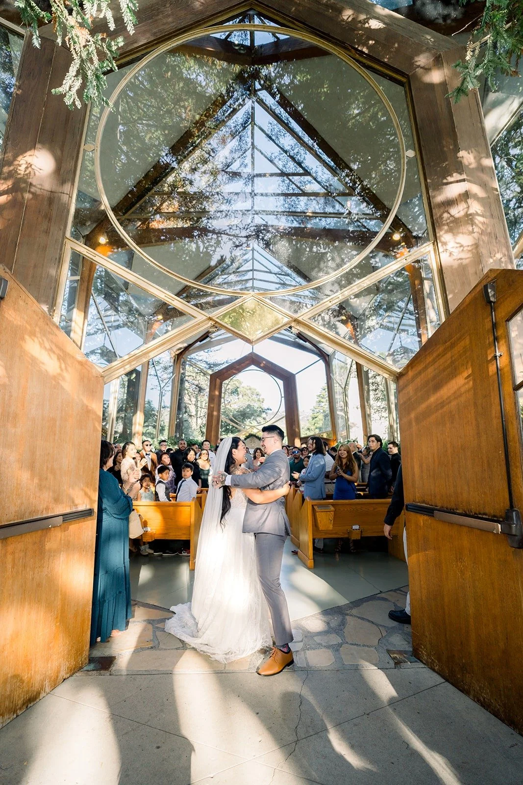 Betsy and Mikey walk back up the aisle as husband and wife, photographed by One and Only Production