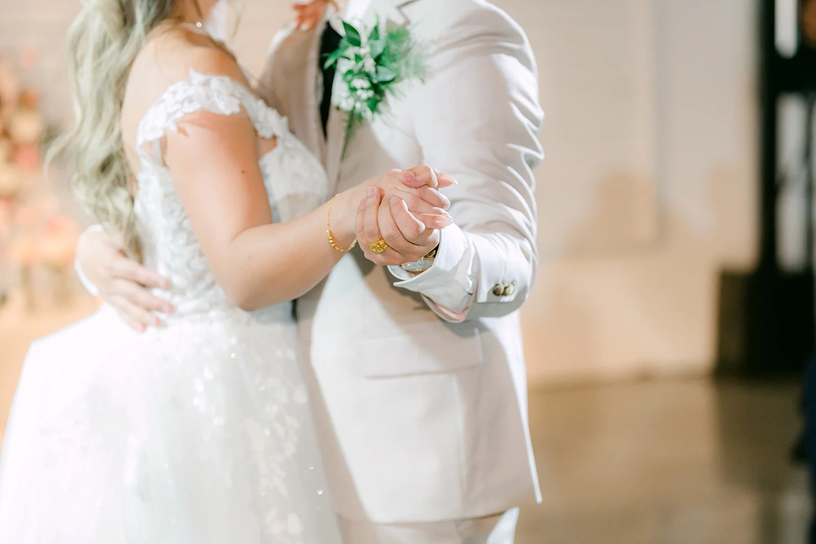 Close up of Raine and Ricky's hands during their first dance