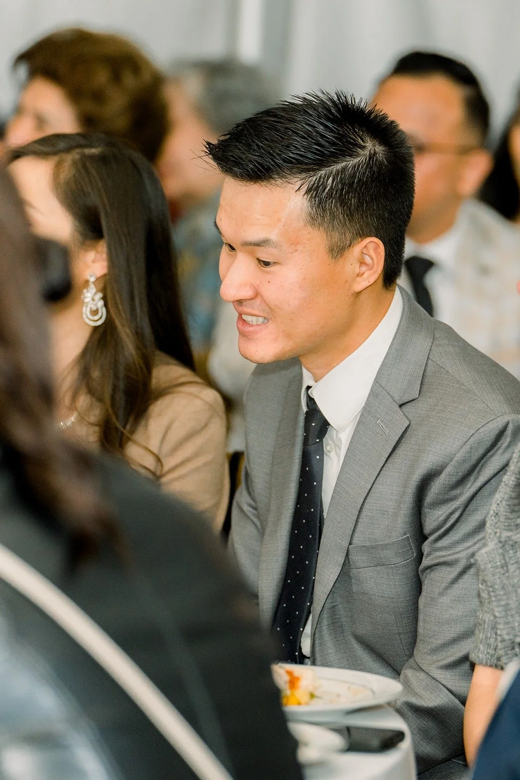 A guest laughing at a toast