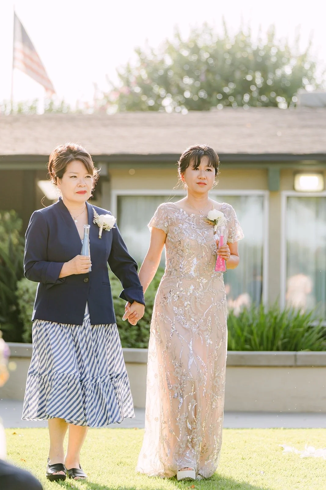 Two family members walking down the aisle together