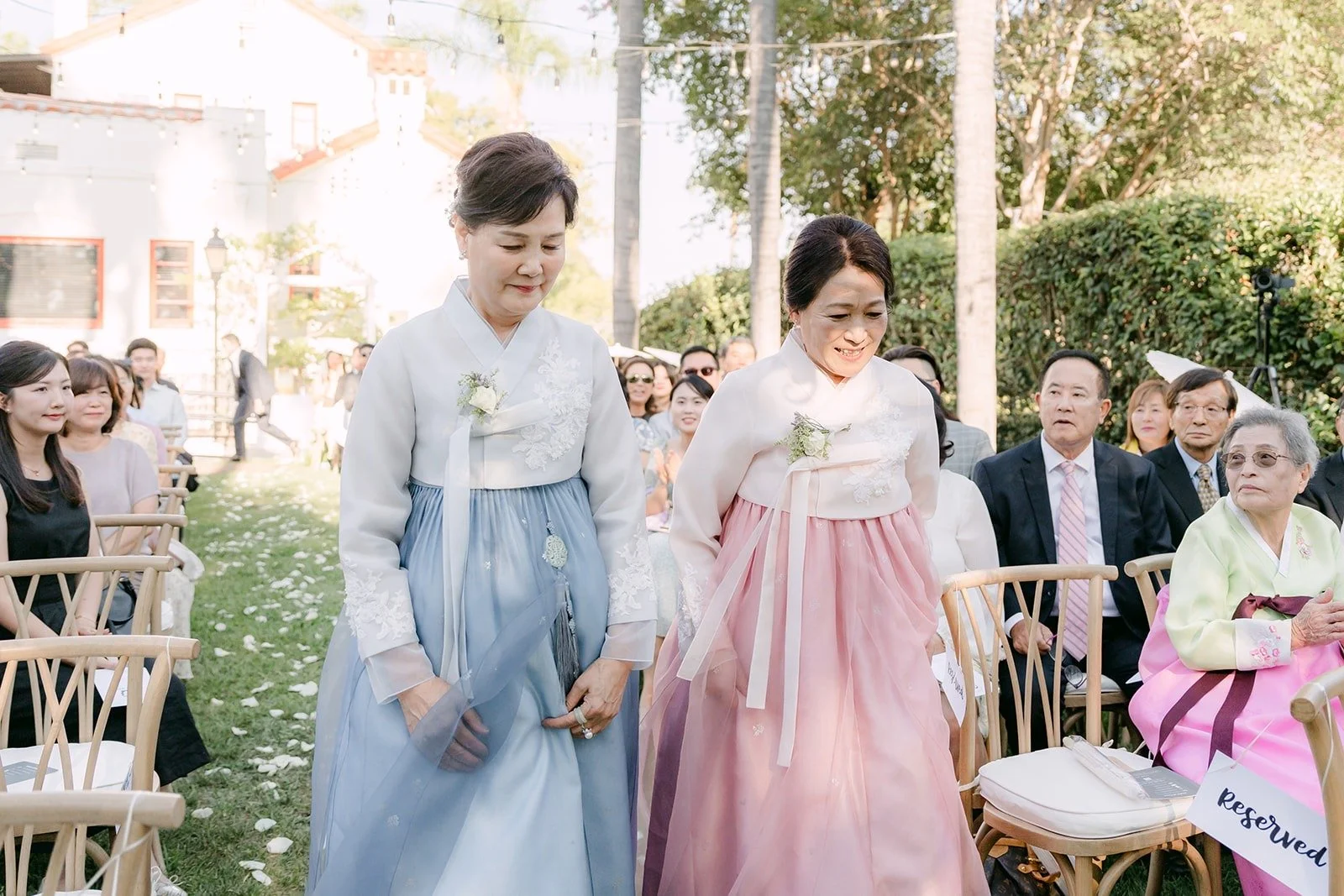 The mothers walking down the aisle in hanbok