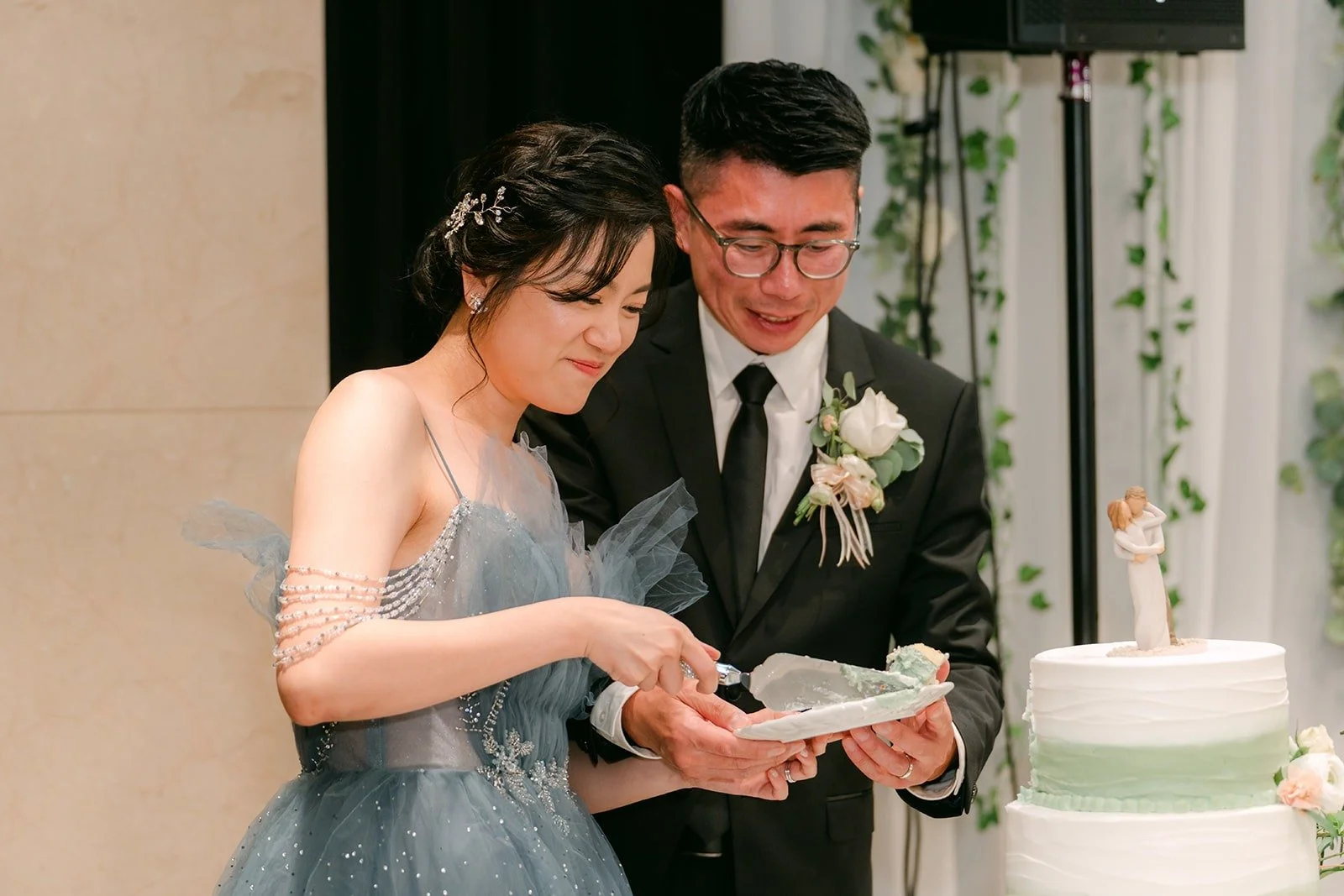 Eunice and Eric share a laugh while serving cake